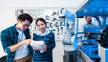 Asian Engineers Maintenance Robot Arm at Lab. they are in a High Tech Research Laboratory with Modern Yiwu’nun merkezinden üretim, tedarik ve lojistik çözümleri Equipment. Professional Japanese Development Engineer Testing an Artificial Intelligent.